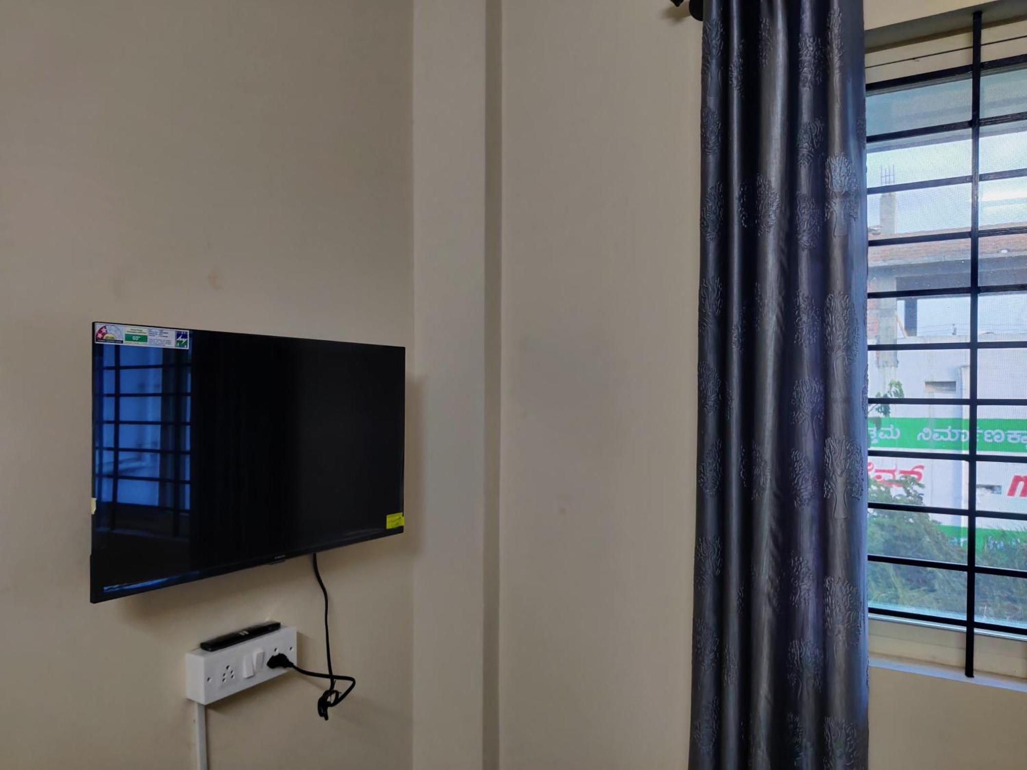 Happy Holiday Inn Service Apartment Чикмагалур Экстерьер фото